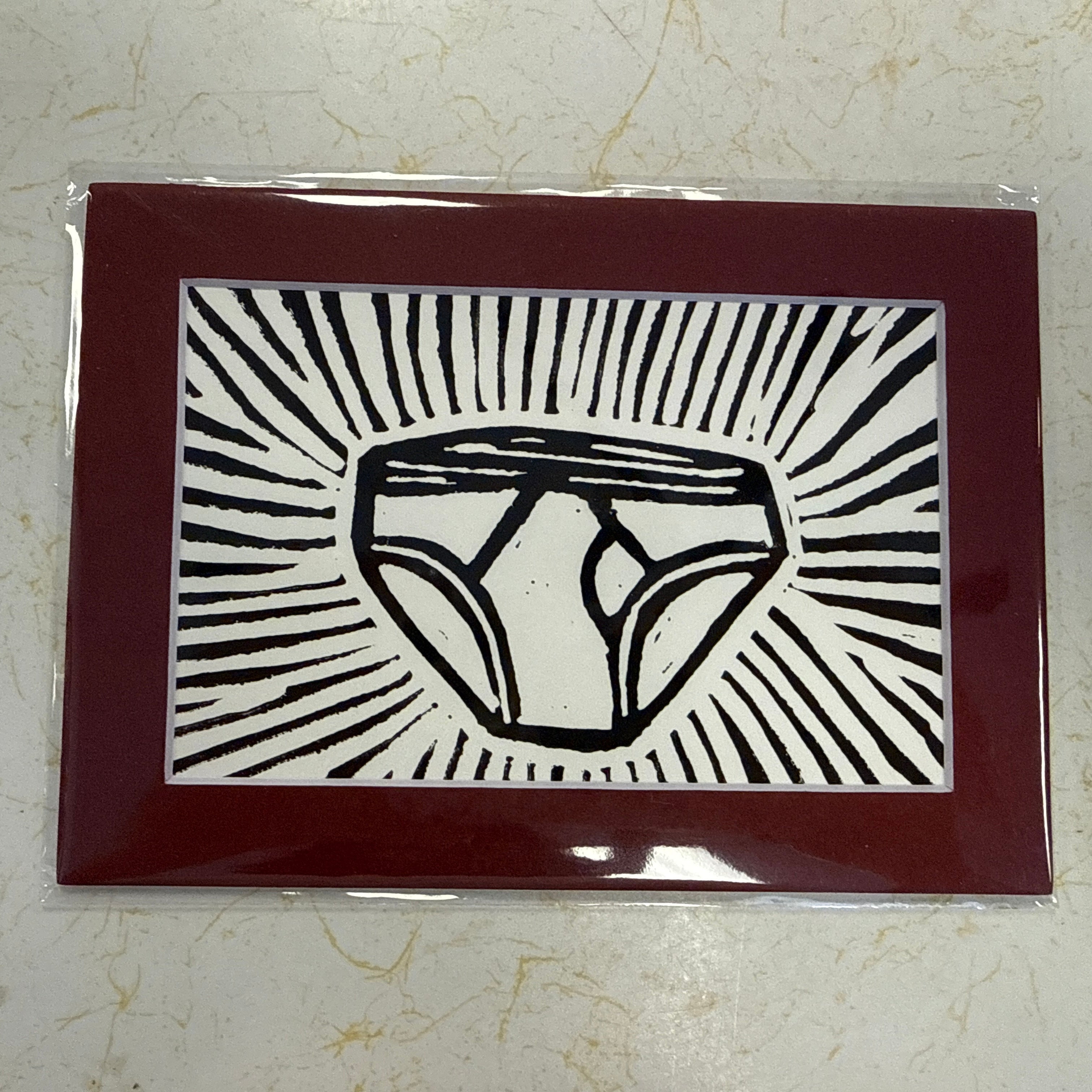 A square art print or card featuring a black line-art illustration of a gemstone on a white background with radiating black